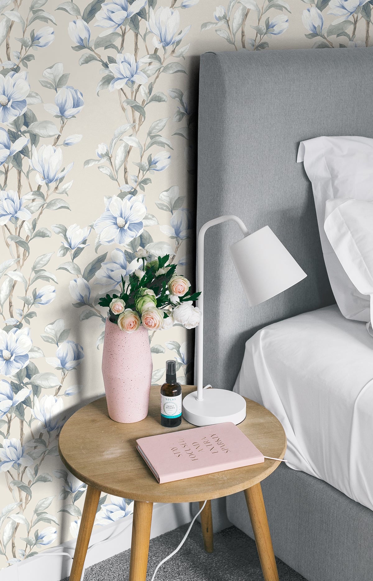 Magnolia Trail Peel and Stick Wallpaper in Linen and French Blue featuring elegant magnolia flowers, flowing botanical branches, and soft blue floral accents. This nature-inspired wallpaper combines classic floral charm with sophisticated blue and neutral tones, making it ideal for accent walls, bedrooms, living rooms, dining rooms, entryways, and cottage-inspired interiors. Removable, washable, and renter-friendly wallpaper design.
