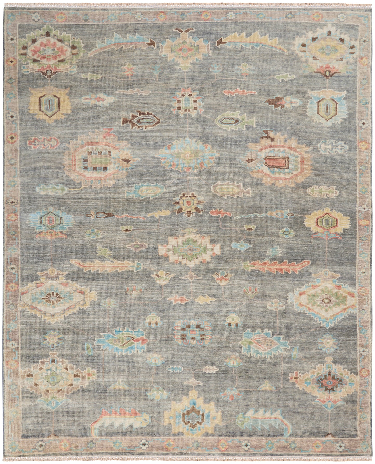 Pastel blue-gray oriental rug with multicolor geometric medallions, floral motifs, and decorative border.