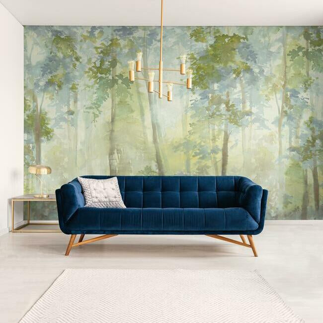 Blue wall mural depicting a forest landscape in blue tones.