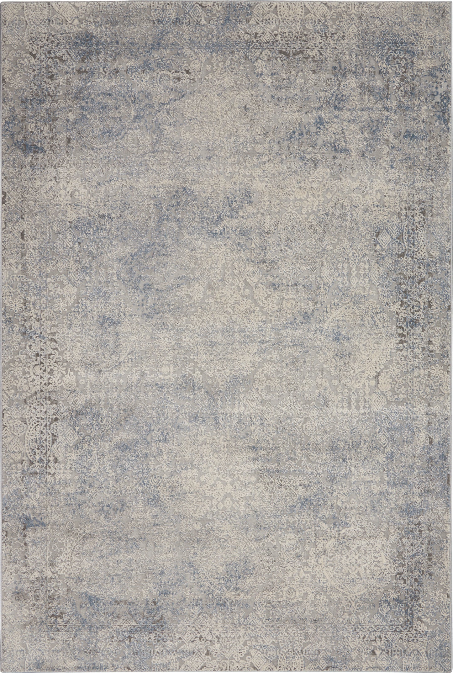 Blue-gray distressed area rug with faded antique medallion patterns in vintage oriental style.
