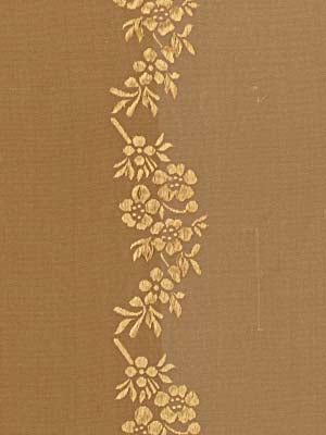 Brown textured fabric with a vertical metallic gold floral embroidery border featuring rose clusters and leaves.