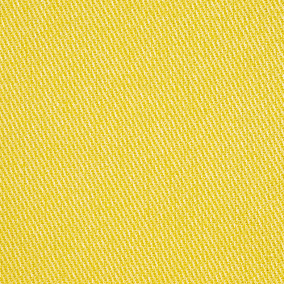 Close-up of bright jonquil upholstery fabric with diagonal twill weave texture.