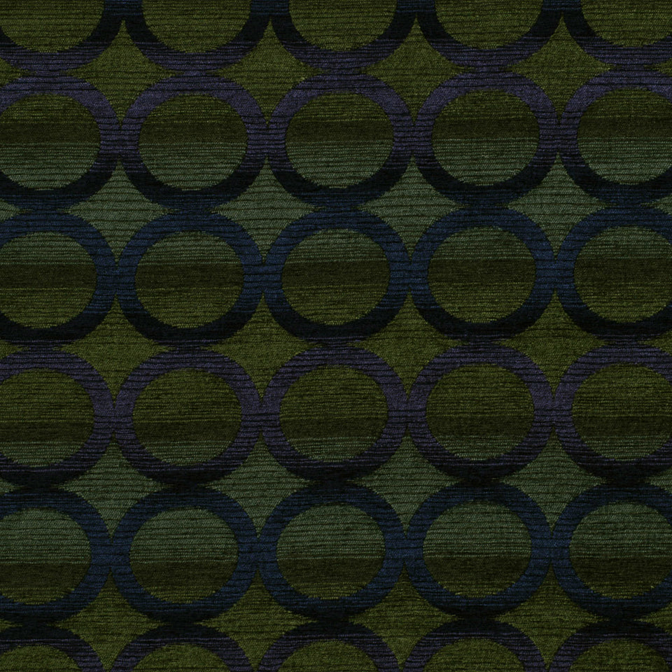 Azure blue fabric with a repeating dark navy circle-ring pattern; textured woven jacquard upholstery fabric.