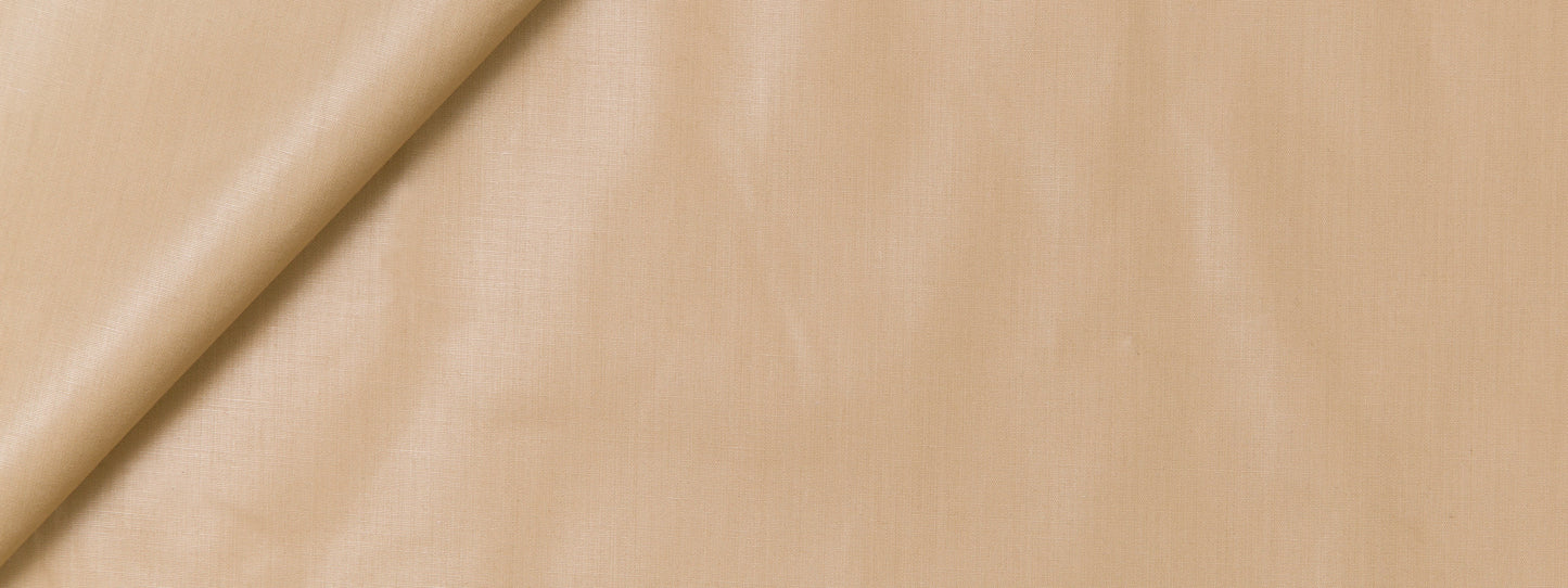 Mustard fabric with a diagonal fold and smooth texture, suitable for clothing or home decor.