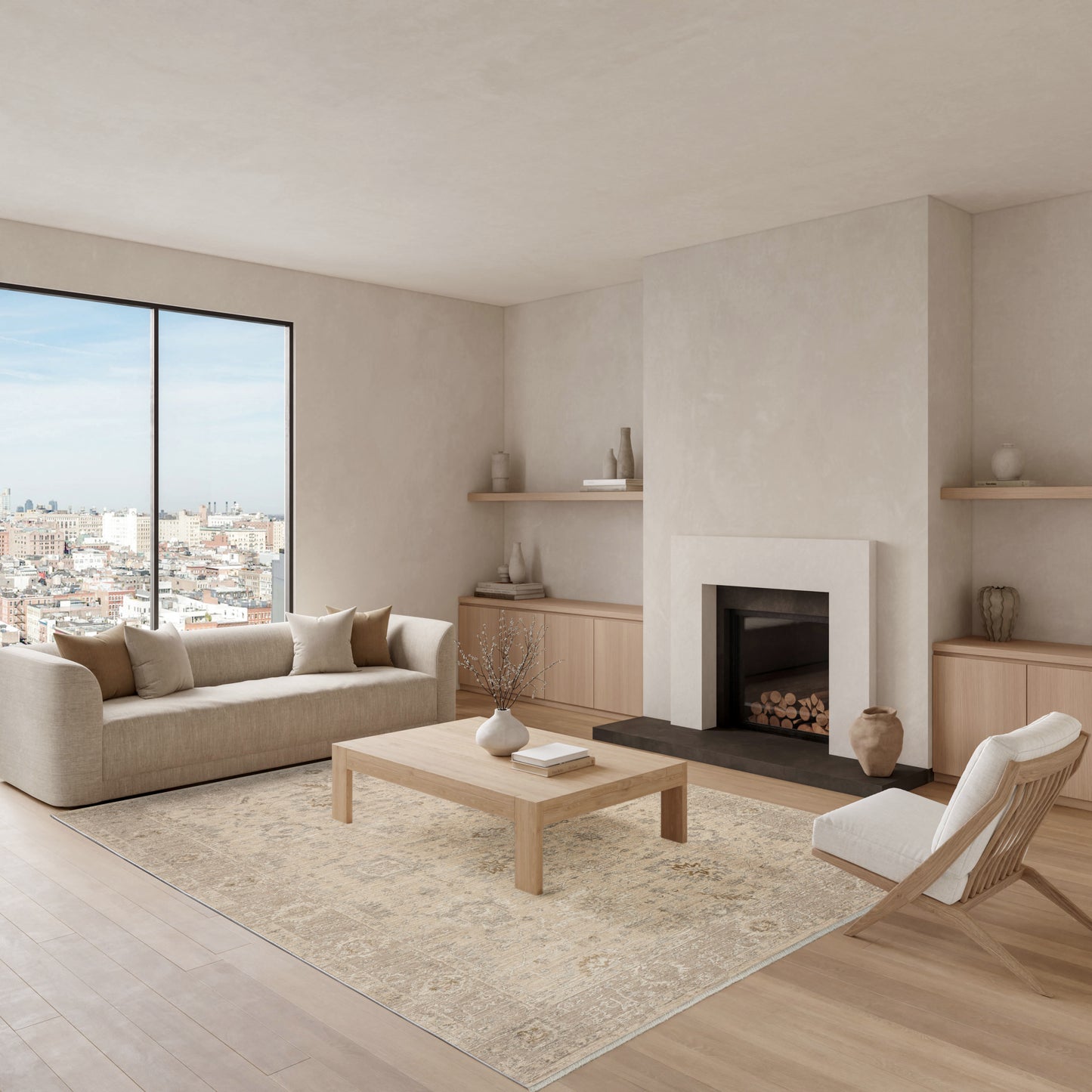 Neutral living room with beige fabric sofa, light wood coffee table, cream rug, fireplace and built-in shelves