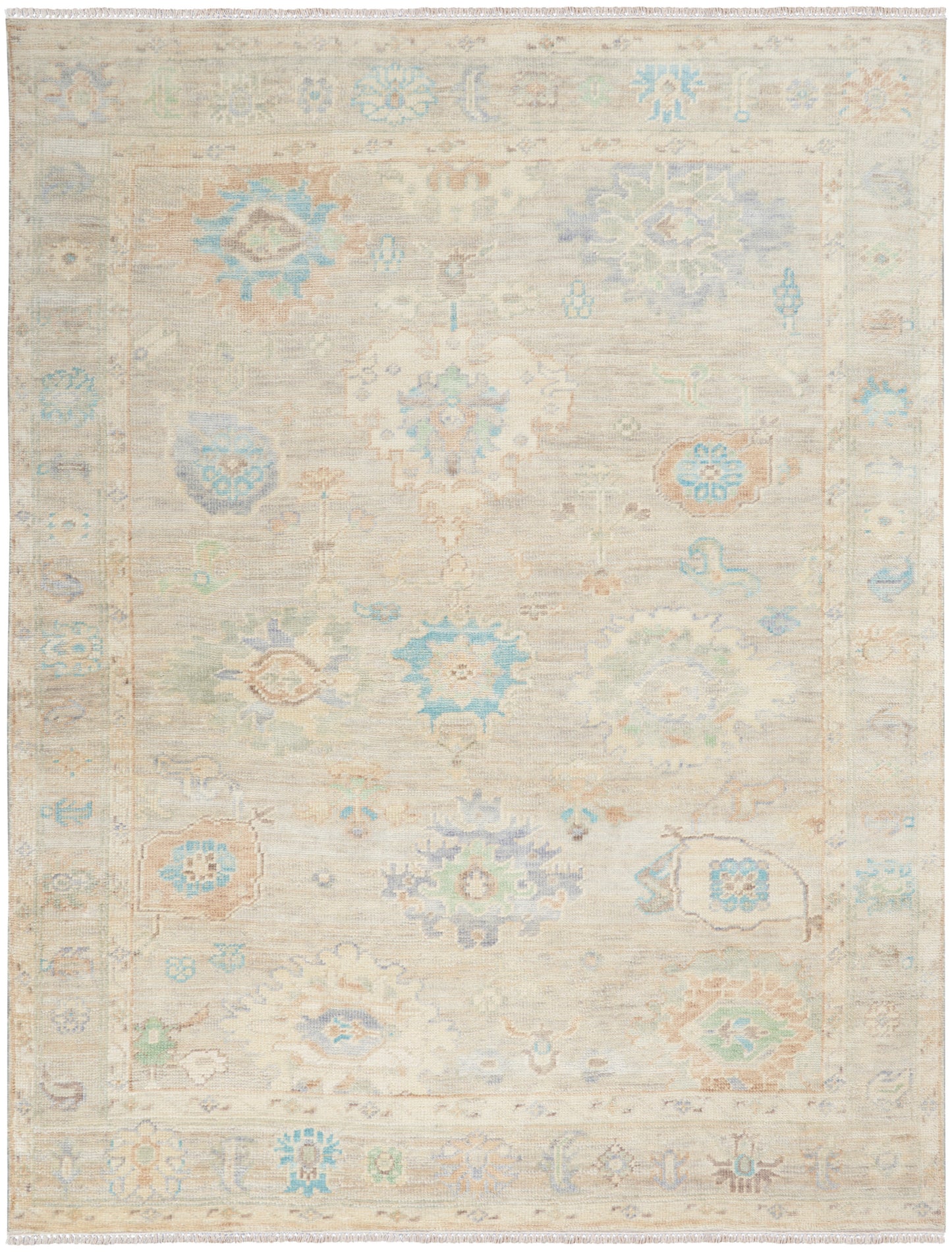 Pastel ivory rug with blue, peach and mint floral motifs, central medallions, bordered fringe, Persian-inspired style.