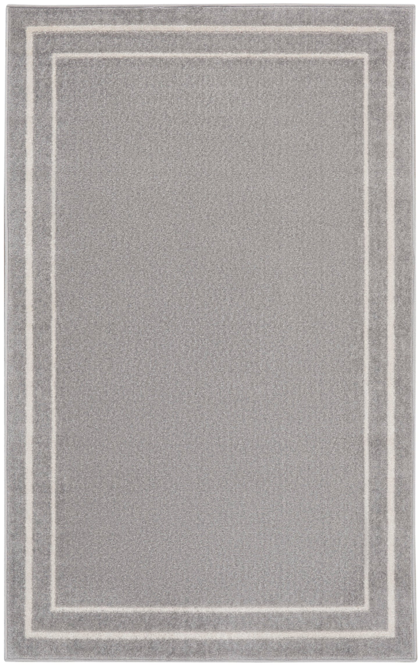 Soft gray plush area rug with double white rectangular borders framing the center.