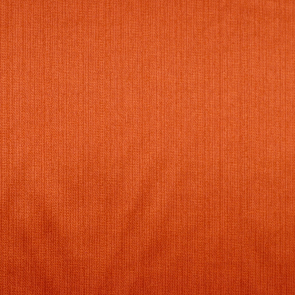 Close-up of orange ribbed knit fabric with soft, textured surface.