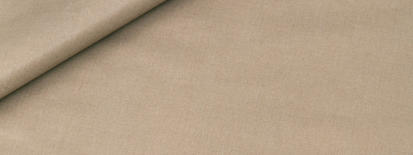 Beige linen-like fabric with a folded corner; smooth, matte textile ideal for upholstery or crafts.