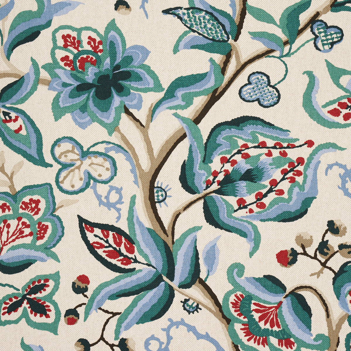 Beige fabric with teal-blue leaves, red berries and brown branches in a lush botanical, tapestry-style print.
