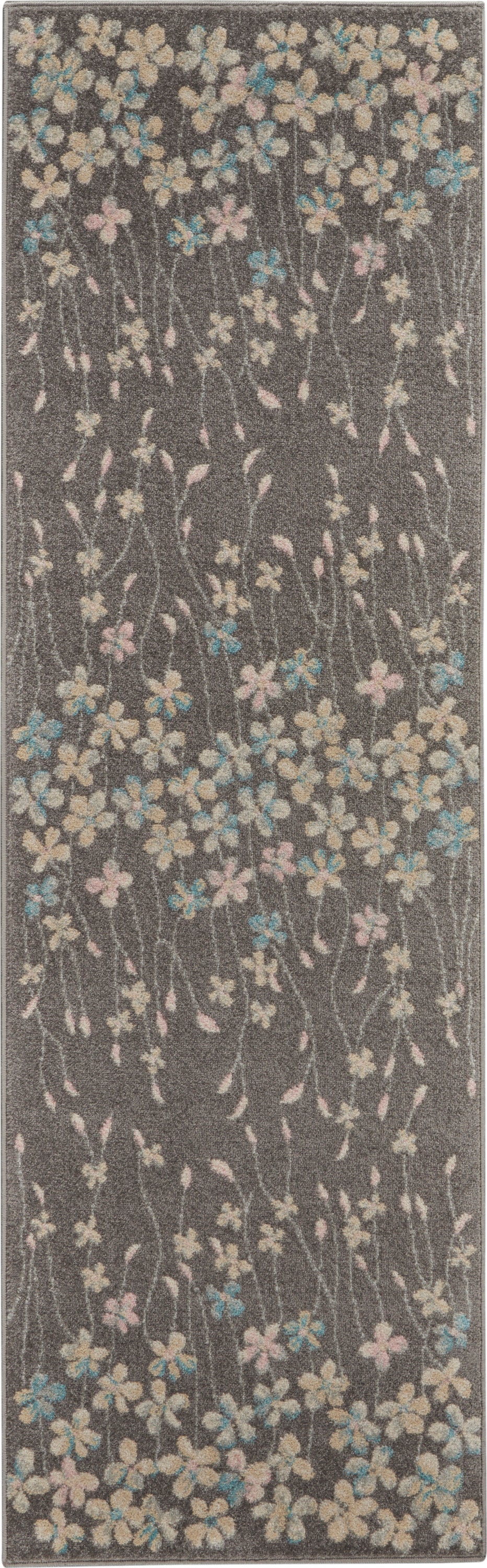 Dark gray floral runner rug with pastel cream, pink and blue blossoms and slender stems.