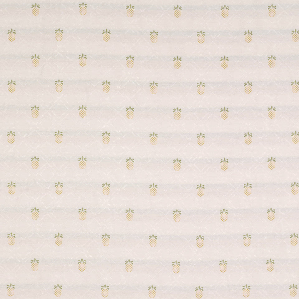 Soft cream fabric with tiny pale-yellow pineapples and green leaves in a repeating tropical pattern.