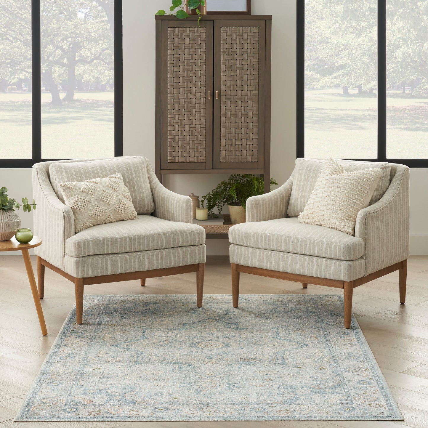 Beige striped vintage-style rug, 5' x 7', laid on the floor.