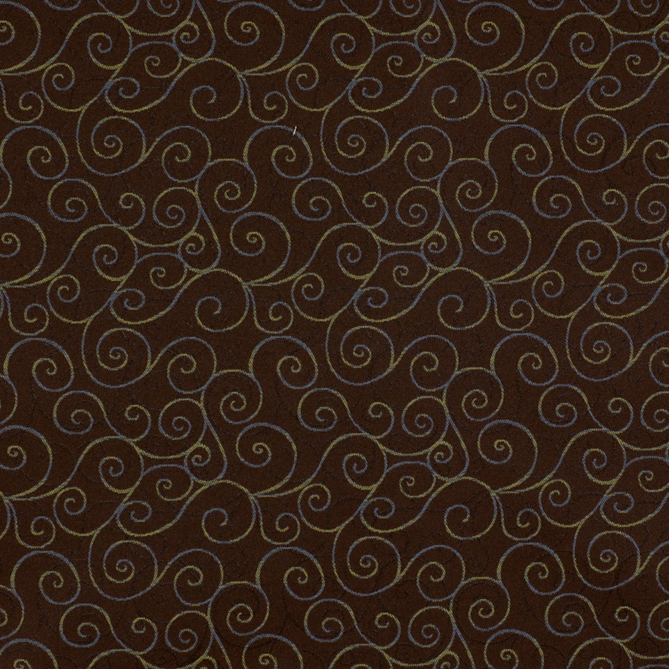 Brown fabric with repeating light blue-gray swirling scroll pattern; damask-inspired ornamental textile.
