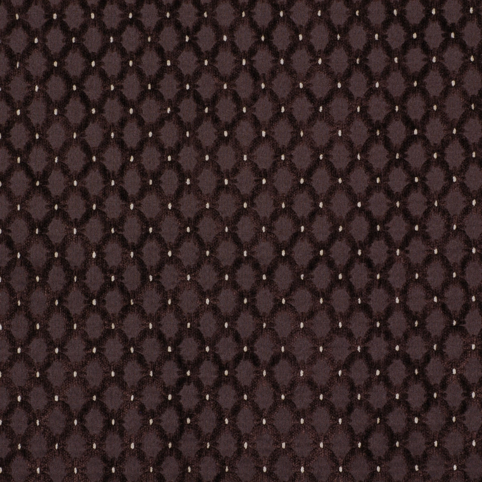 Dark espresso-brown quilted upholstery fabric with a repeating raised dot pattern forming a diamond lattice.