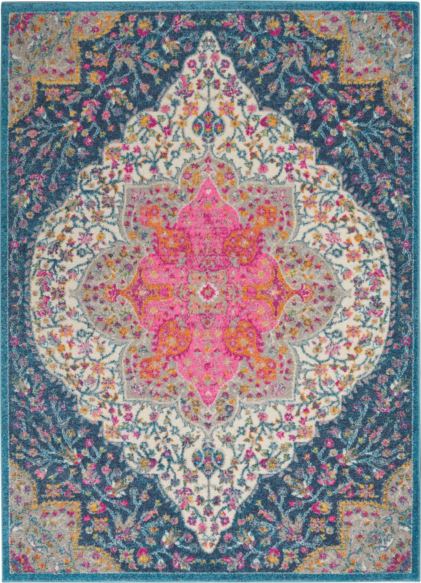 Colorful oriental rug with a pink central medallion, navy field, teal border, and vibrant floral motifs.