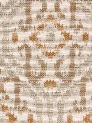 Close-up of woven damask upholstery fabric in ivory and warm orange-brown, with an ornate symmetrical motif.