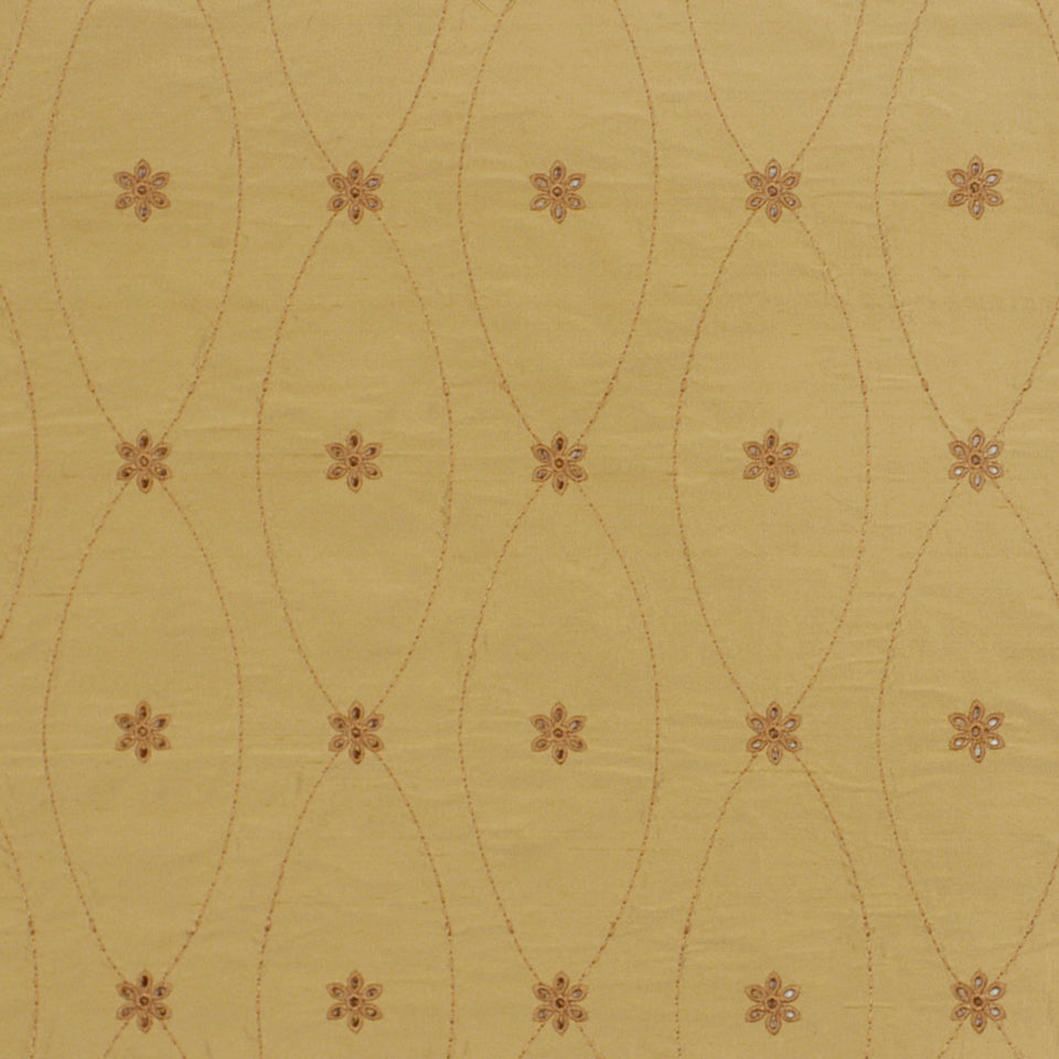 Yellow fabric with a repeating arched oval lattice and small brown embroidered flowers.