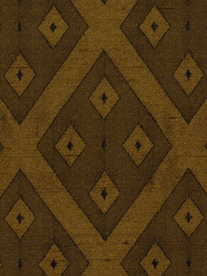 Earthy brown rug with large diamond motifs in ochre and dark brown; geometric kilim-inspired pattern.