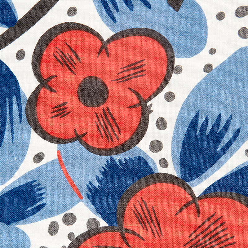 Bold floral fabric print: red-pink flowers with brown outlines, blue leaves, white background with gray polka dots.