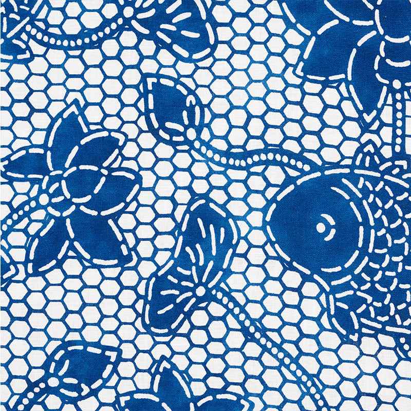 Blue floral lace pattern on white fabric with hexagonal mesh background, decorative textile for clothing or decor