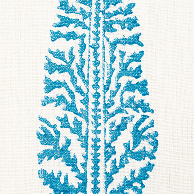 Bright teal fern-print on beige linen, vertical botanical motif on textile.