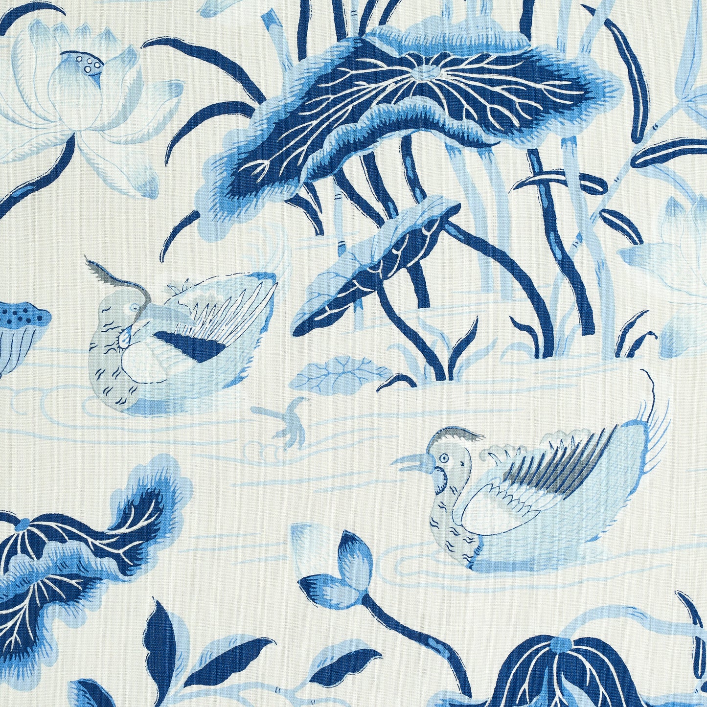 Blue and white porcelain print featuring birds, lotus flowers and reeds in a decorative water scene.