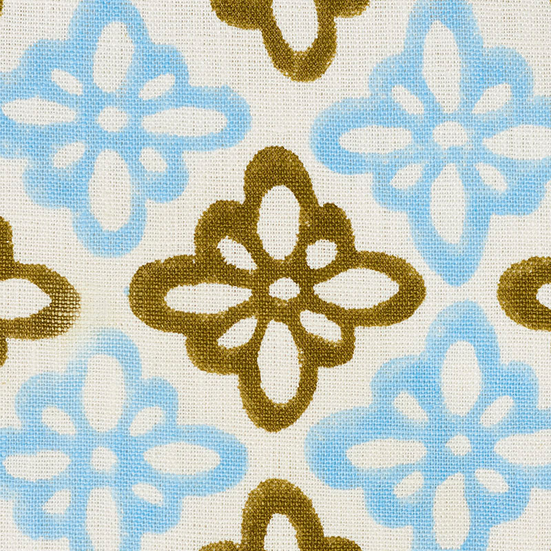 Beige linen-textured fabric with sky blue and olive-brown floral quatrefoil motifs; retro geometric floral pattern.