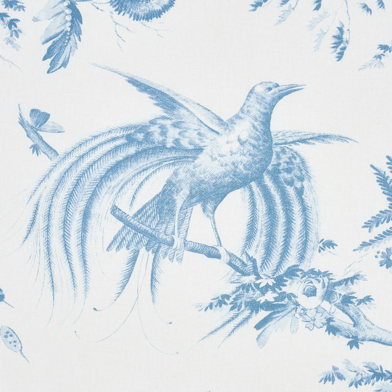 Blue toile-style bird pattern on white fabric; ornate bird with long tail perched on a branch among leaves.