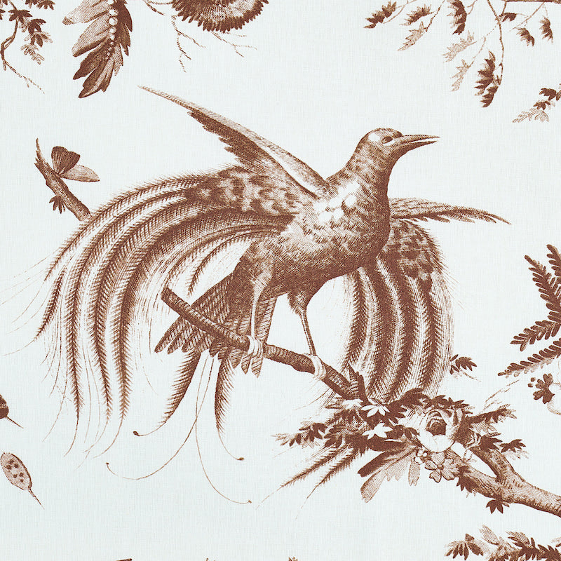Sepia-toned bird with long flowing tail perched on a branch; toile pattern on light fabric.