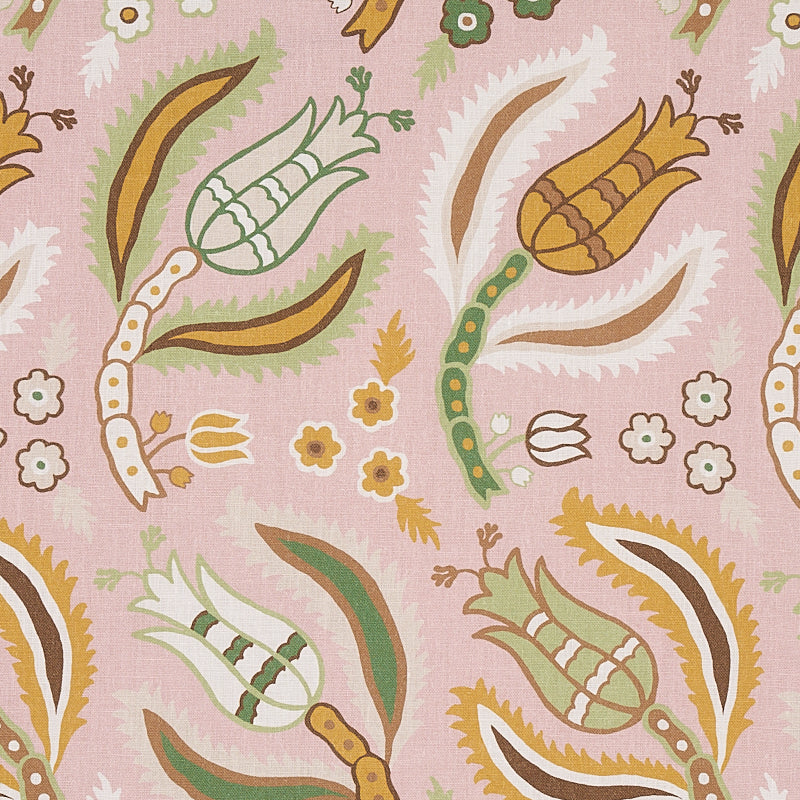 Pink fabric with repeating paisley floral motifs in green, white, yellow and brown.