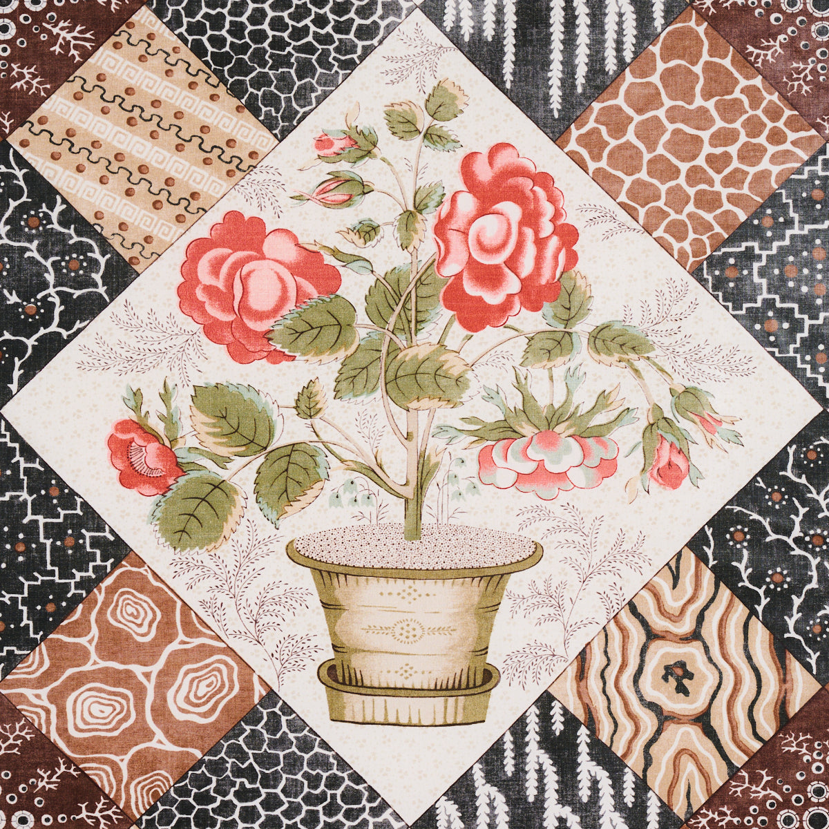 Patchwork quilt square featuring a central potted red rose bouquet, framed by brown, black and beige patterned fabric patches.