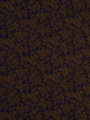 Brown damask floral pattern on a deep navy background; vintage-inspired upholstery fabric.