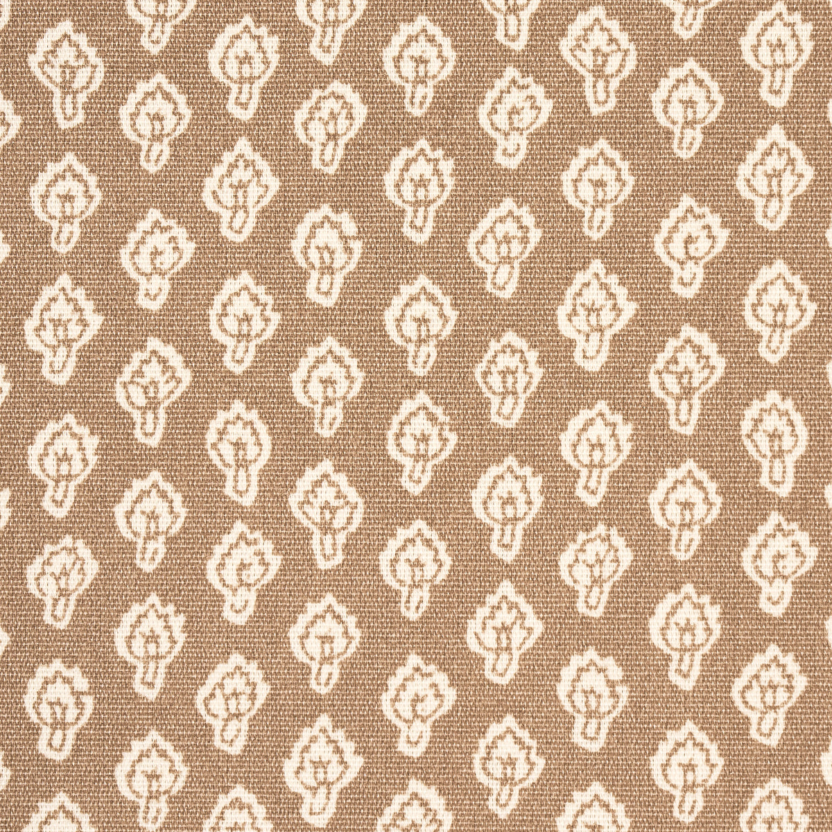 Tan fabric with a repeating white floral/teardrop motif forming a damask-like geometric pattern.
