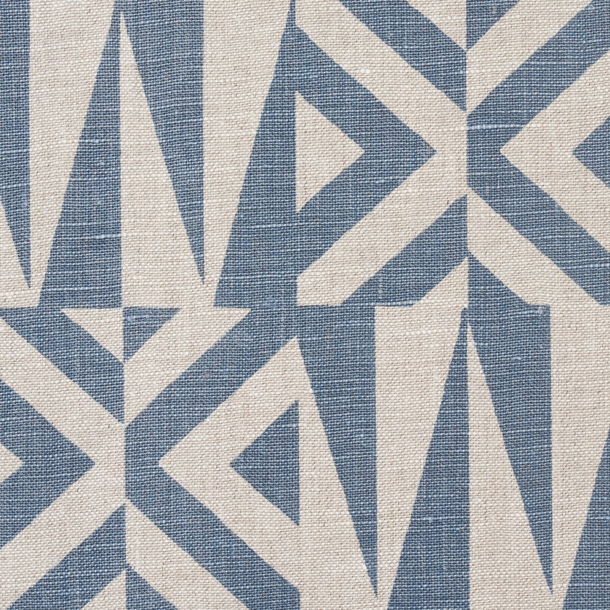 Blue and cream geometric woven textile with triangles and chevrons, linen-like fabric for upholstery or decor.