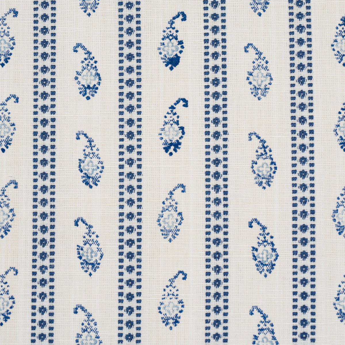 Blue paisley & geometric stripe pattern on cream woven fabric.