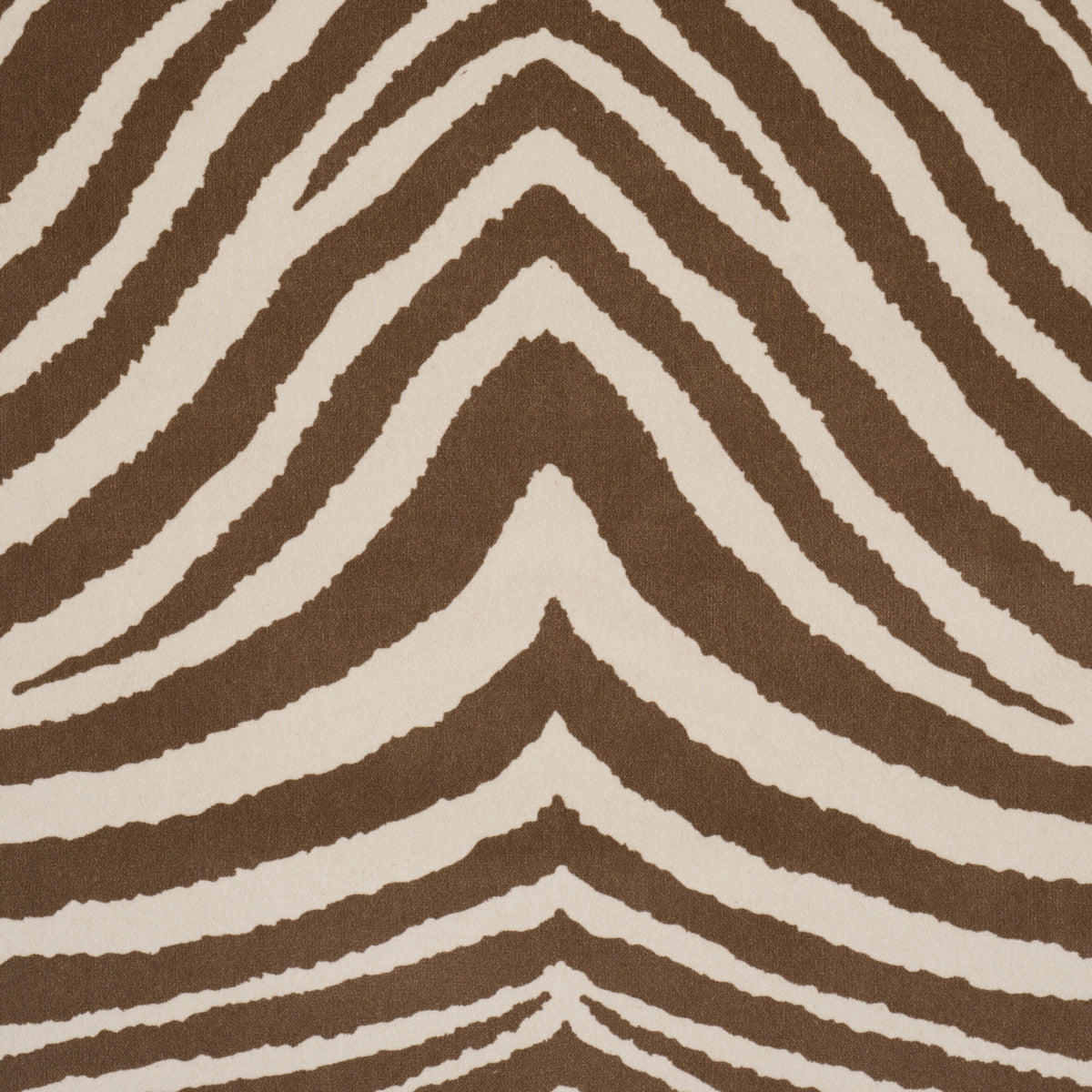Brown and beige zebra-striped rug with a wavy chevron pattern.