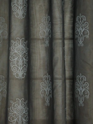 Dark gray drapery panels with light silver-gray damask embroidery motifs, soft, flowing curtains.