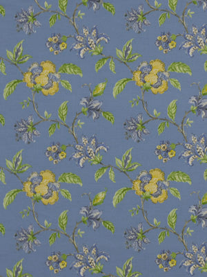 Blue floral fabric with yellow and purple flowers and green leaves in a vintage botanical print.