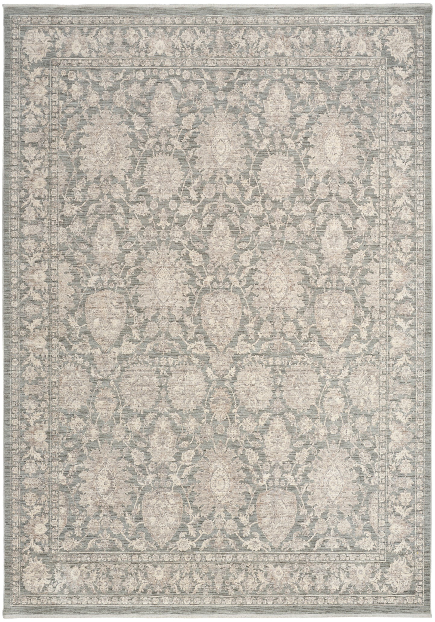 Rectangular area rug in blue-gray with ivory damask floral pattern and ornate border; traditional decor.