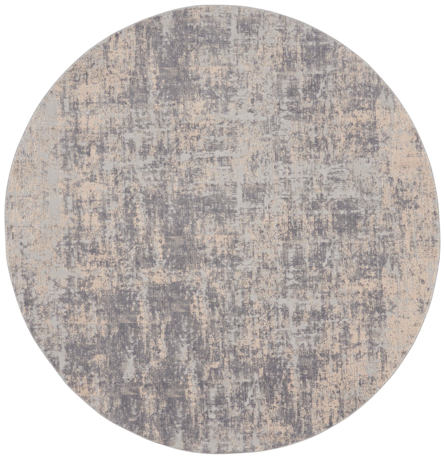 Round abstract rug in gray and beige with distressed, mottled pattern; modern, soft textile.