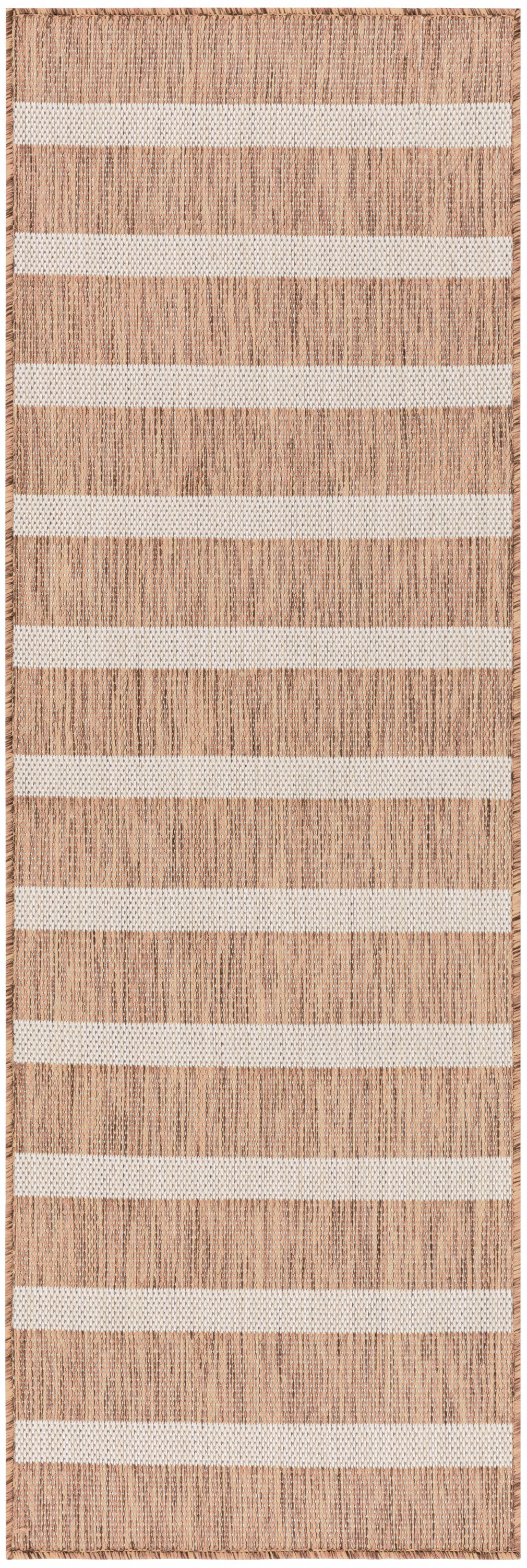 Natural tan woven rug with white horizontal stripes and fringed edges; rustic coastal style.
