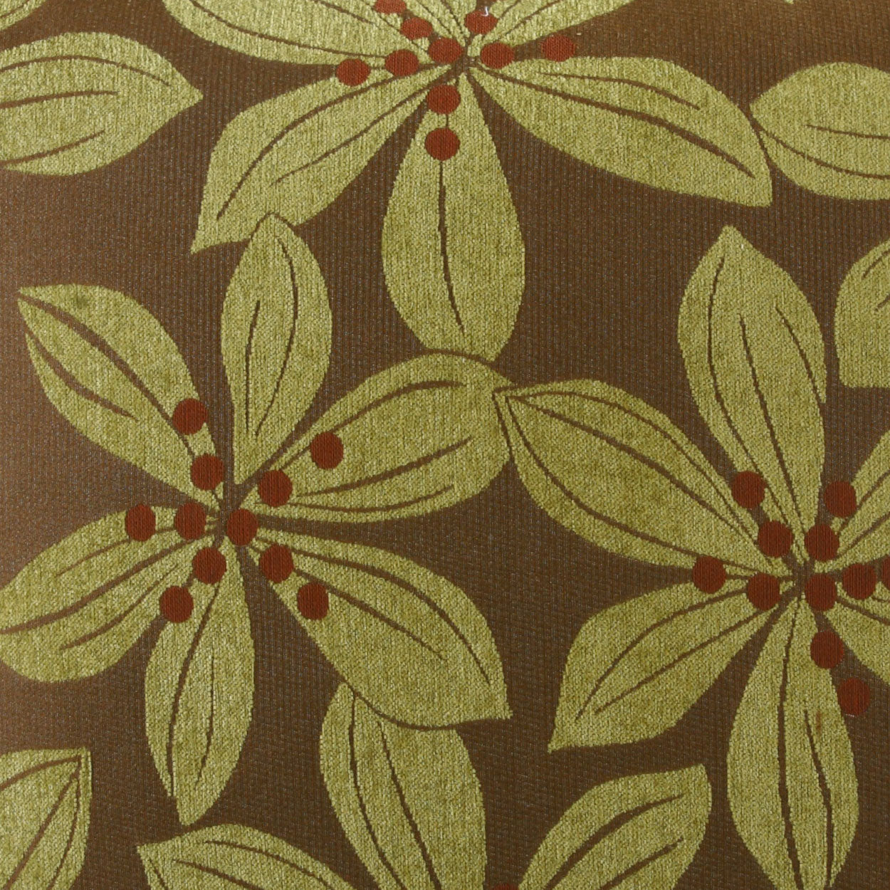 Brown fabric with lime-green leafy floral pattern and small red berries in a repeating botanical motif.