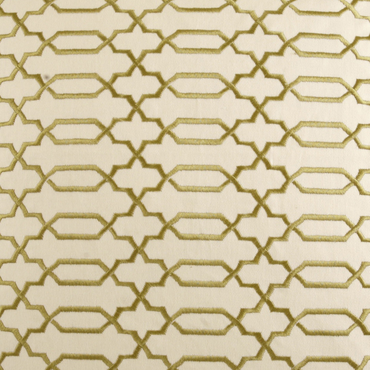 Cream fabric with gold metallic geometric lattice pattern of interlocking hexagons, elegant upholstery style.