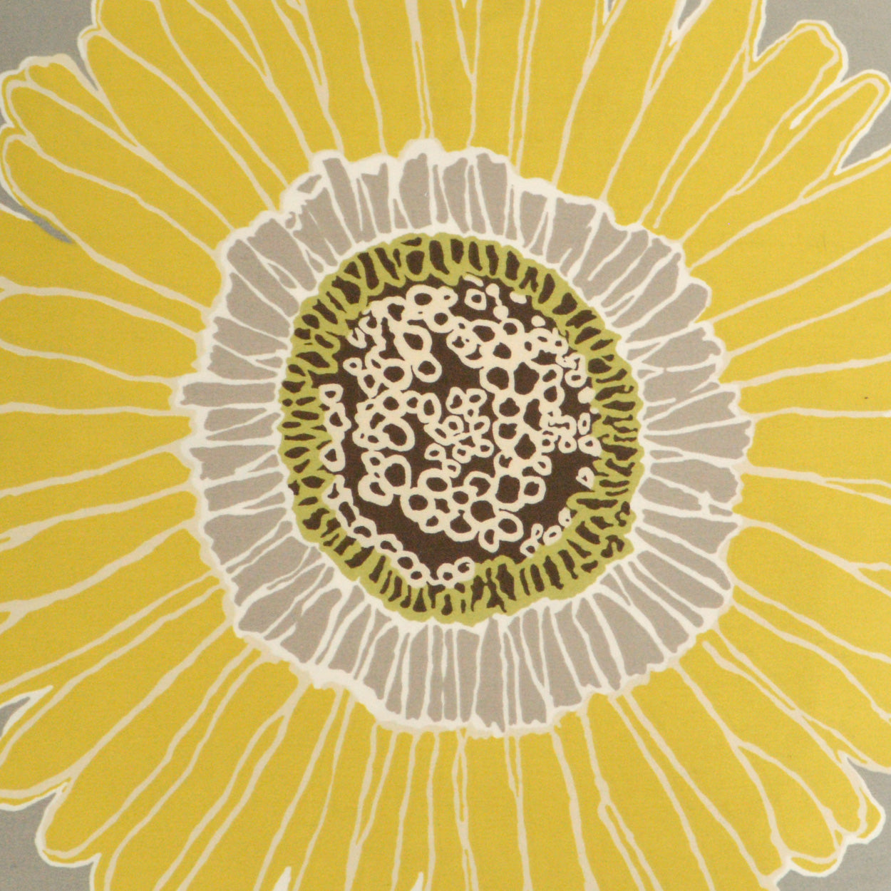 Yellow floral fabric with large sunny petals and a dark brown center.