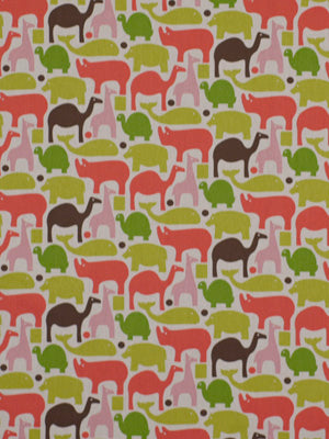 Pink drapery fabric with repeating horse silhouettes in red, pink, green and brown on a beige background.