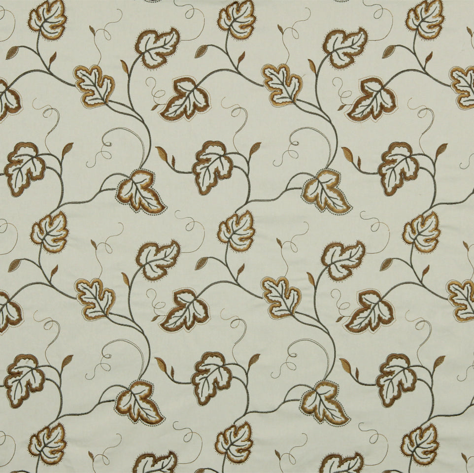 Cream fabric with brown and tan leaf vines and curling scrolls; embroidered-like pattern for upholstery.