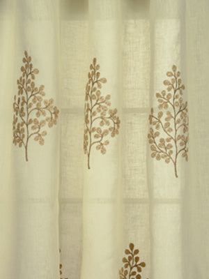 Golden sheer curtain with embroidered brown botanical sprigs repeated in vertical rows
