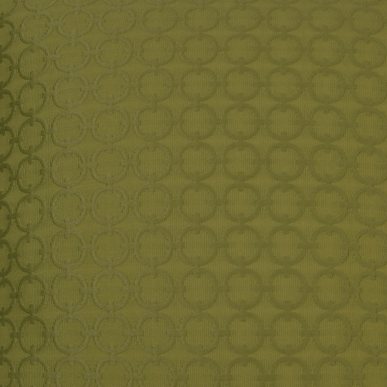 Olive green full-circle pillow with a circular dot pattern.