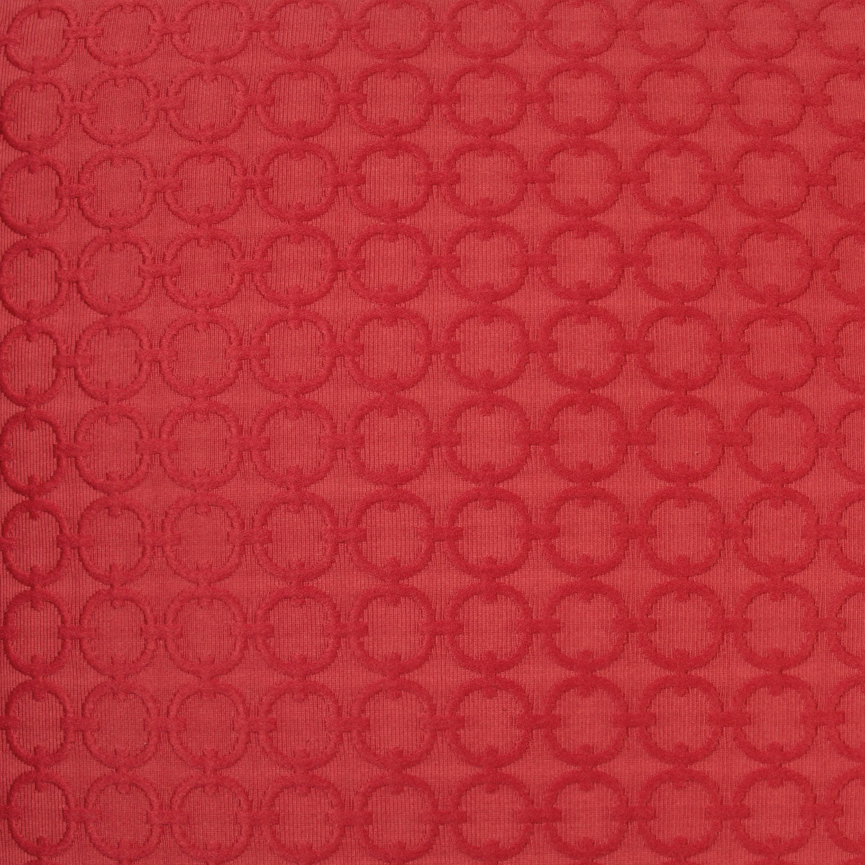 Red circular pillow with solid red fabric, 24" x 24".